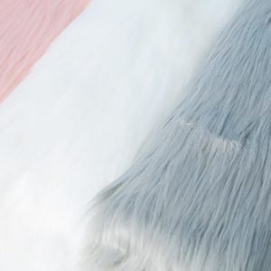 Thick and fluffy faux fox fur in a soft long pile of 6 cm, made from synthetic fibers. Use this plush fabric to create fursuit paws, tails, or animal ears for cosplay and DIY projects. The 17.72 × 33.46 inch size allows enough fabric for key costume parts while remaining easy to cut and handle for both professionals and beginners.