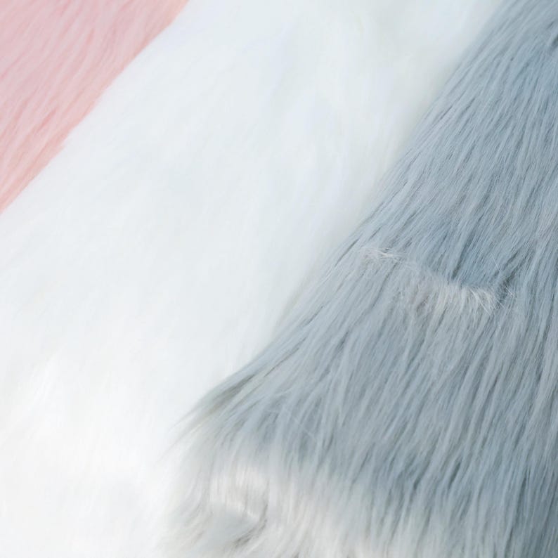 Thick and fluffy faux fox fur in a soft long pile of 6 cm, made from synthetic fibers. Use this plush fabric to create fursuit paws, tails, or animal ears for cosplay and DIY projects. The 17.72 × 33.46 inch size allows enough fabric for key costume parts while remaining easy to cut and handle for both professionals and beginners.