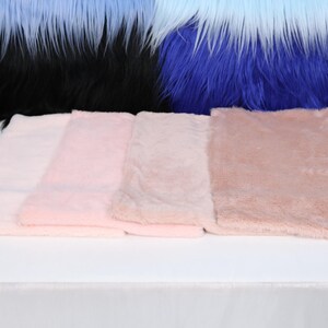 Pink faux rex fur fabric with ultra-soft short plush pile and realistic texture. Perfect for fursuit building, costume lining, or plush toy ears and paws. This cozy synthetic fabric is great for close-to-skin projects thanks to its smooth and skin-friendly surface. Sized for small craft or cosplay designs.