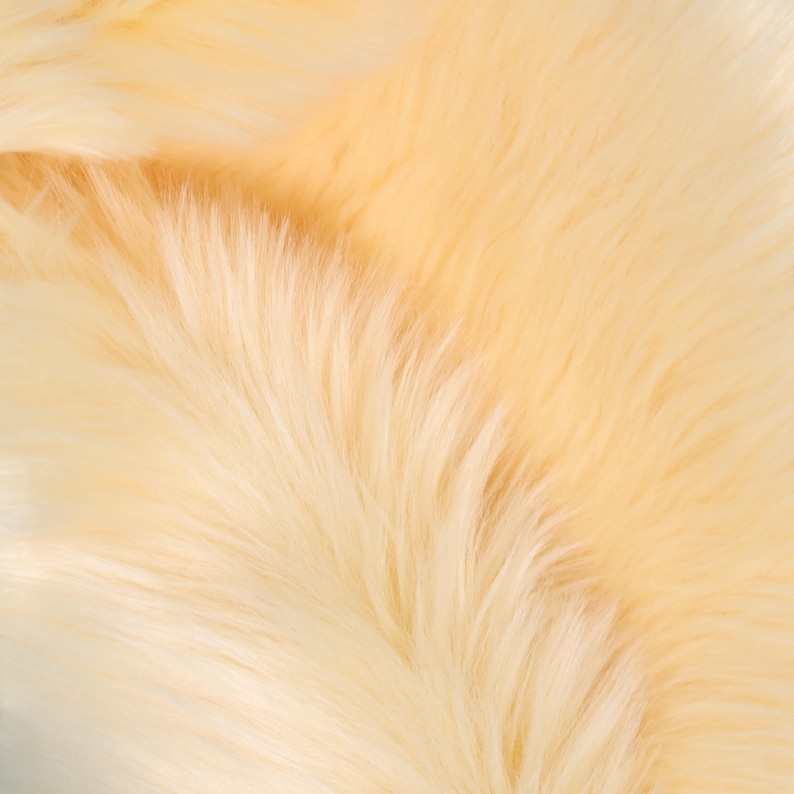 Long pile faux fur with soft 6 cm fibers made from synthetic materials. This fabric is perfect for fursuit construction, costume props, and furry cosplay. Its thick texture mimics real fox fur while remaining ethical and easy to sew. Use for fluffy tails, oversized ears, or paw accents with lightweight volume and lifelike motion.