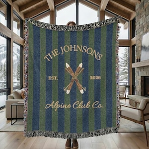 Personalized alpine blanket with family name and establishment year woven into cotton throw design, alpine ski club design in preppy navy green heritage design, beautiful wall decor and home textile