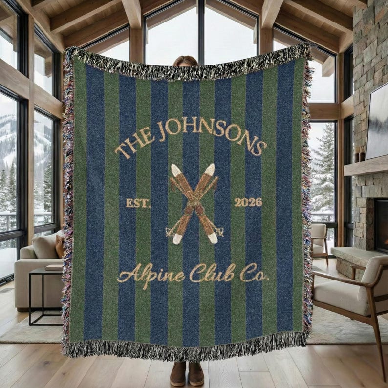 Personalized alpine blanket with family name and establishment year woven into cotton throw design, alpine ski club design in preppy navy green heritage design, beautiful wall decor and home textile