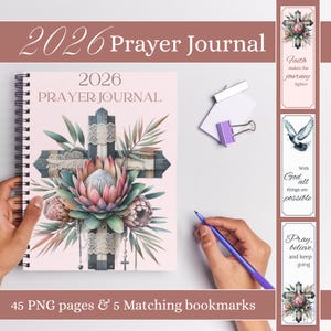 May include: A spiral-bound 2026 Prayer Journal with a floral cross design on the cover. The journal is light pink with the text "2026 Prayer Journal". Includes 5 matching bookmarks with inspirational quotes and a purple pen.