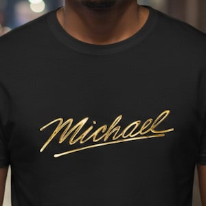 May include: A white ceramic mug with a black handle and the text "But First, Coffee" in a bold, black font. The mug is set against a blurred background, suggesting a cozy setting.