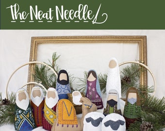 May include: A felt nativity set with the title "O Holy Night" embroidered felt nativity pattern. The set includes figures of Mary, Joseph, baby Jesus, a camel, a shepherd, and two sheep. The figures are all hand-stitched and have intricate details.