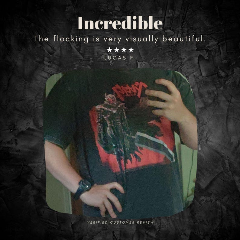 May include: Black t-shirt with a red and black graphic design. The shirt features the word "Incredible" at the top, along with a customer review. The shirt is a short-sleeved crew neck.