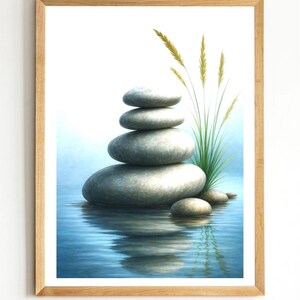 Può includere: Una stampa artistica incorniciata raffigurante una pila di quattro pietre lisce grigio chiaro in equilibrio su una superficie d'acqua blu riflettente. Accanto alle pietre, un gruppo di alti e sottili steli d'erba verde si eleva. Il testo lab digital designer è visibile.
