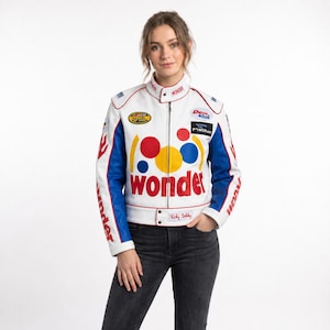 May include: A white racing jacket with blue sleeves and red accents, featuring the word "wonder" in large red letters on the front. The jacket includes various colorful circular graphics, sponsor logos, and the name "Ricky Bobby" printed on a tab.