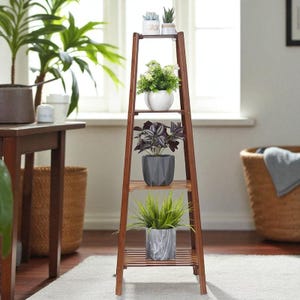 May include: A wooden plant stand with four shelves, holding various potted plants. The stand is a warm brown color and has a ladder-like design. The plants include succulents, leafy green plants, and a plant with purple leaves.