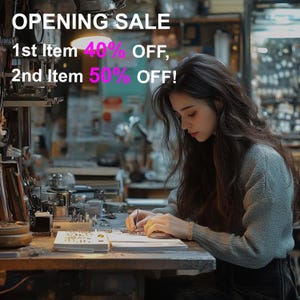 May include: A woman working at a workbench, possibly crafting jewelry. The image features the text "OPENING SALE" with discounts of 40% and 50% off. The woman is wearing a gray sweater and is focused on her work.