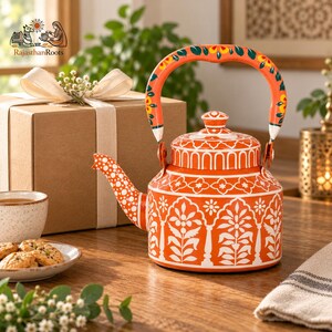 May include: A vibrant orange metal teapot featuring intricate white floral and geometric patterns. The handle is painted with orange, green, and yellow floral motifs. The spout is decorated with white polka dots, and the lid has a matching knob.