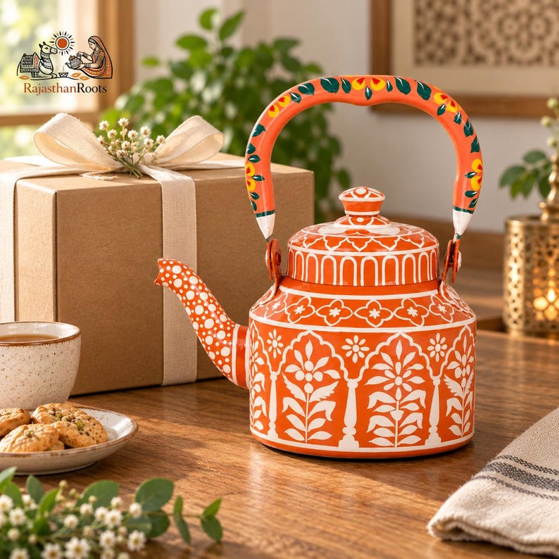 May include: A vibrant orange metal teapot featuring intricate white floral and geometric patterns. The handle is painted with orange, green, and yellow floral motifs. The spout is decorated with white polka dots, and the lid has a matching knob.