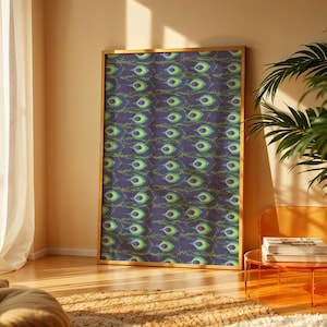 May include: A framed artwork featuring a repeating pattern of peacock feather designs in shades of blue, green, and yellow. The artwork is displayed in a room with natural light and a plant.
