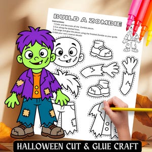 Op de afbeelding: Een Build a Zombie papieren knutselblad met een kleurrijke cartoonzombie met paars haar, groene huid en een gehavend paars jasje. Het blad bevat zwart-witte contouren van zombielichaamsdelen om uit te knippen, te plakken en in elkaar te zetten.