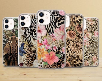 May include: Five clear phone cases with various animal print designs. The cases feature leopard, zebra, and floral patterns with pink and orange flowers. The cases are displayed on a light brown wooden surface.