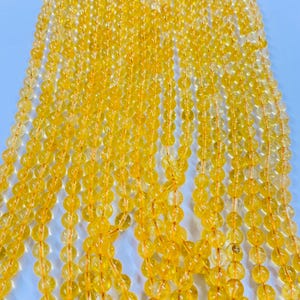Crystal-Dyed Citrine Beads: Smooth Round Yellow Gemstone, 15” Strand