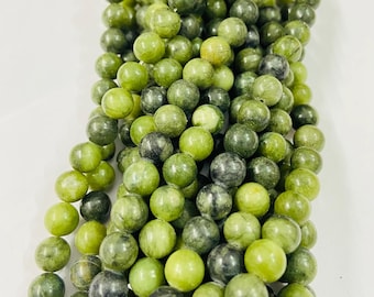 May include: Strands of round, polished beads in shades of green and gray. The beads have a smooth, glossy finish and vary in color, creating a natural, organic look. These beads are suitable for jewelry making and crafting projects.