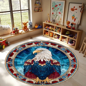 May include: A round area rug featuring a detailed illustration of an eagle with a white head, a yellow beak, and blue and red feathers. The rug has a stained-glass effect with a blue background and a decorative border.