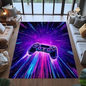 May include: A rectangular rug with a neon video game controller design. The rug has a dark purple and blue background with streaks of pink and blue light radiating from the controller. The rug is suitable for a living room.