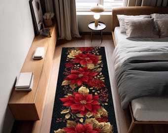 Op de afbeelding: Een rechthoekig zwart tapijt met een bloemenontwerp met grote rode poinsettia's, gouden bladeren en rode bessen. Het tapijt is geplaatst in een slaapkameromgeving en voegt een vleugje elegantie toe aan de ruimte.