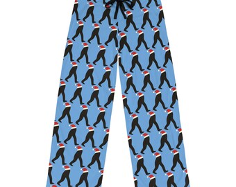 May include: Blue pajama pants with a repeating pattern of figures in black suits and red Santa hats. The pants have a drawstring waist and are made of a soft, comfortable material.