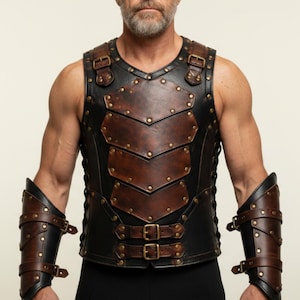 May include: A medieval-style leather armour vest and arm bracers. The vest is brown and black, with brass rivets and buckles. The arm bracers have a similar design, with multiple straps and rivets. A striking piece of historical-inspired attire.