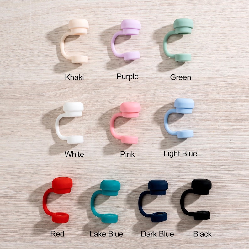May include: A collection of nine colorful silicone straw tips in various shades, including khaki, purple, green, white, pink, light blue, red, lake blue, dark blue, and black. Each tip is labeled with its corresponding color name.