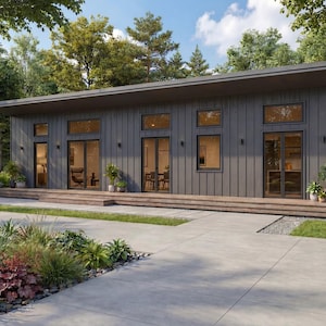 May include: A contemporary single-storey house with a dark grey exterior and a flat roof. Large windows and glass doors provide ample natural light. The house is surrounded by lush landscaping, including a concrete walkway and a variety of plants.