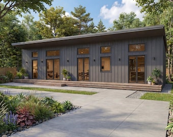 May include: A contemporary single-storey house with a dark grey exterior and a flat roof. Large windows and glass doors provide ample natural light. The house is surrounded by lush landscaping, including a concrete walkway and a variety of plants.