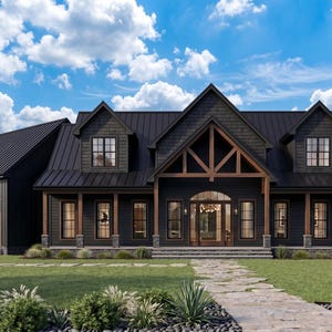 May include: A large, modern house with a dark exterior, featuring a black roof and siding, and wooden accents. The house has multiple windows, a front porch, and a stone pathway leading to the entrance. The sky is blue with fluffy white clouds.