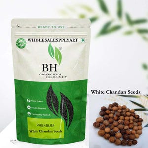 May include: A white and green bag of "White Chandan Seeds" with the text "WHOLESALESPPLYART" and "BH ORGANIC SEEDS HIGH QUALITY". The bag also states "Hand Picked", "Double Cleaned", and "Hygienically Packed". A small pile of seeds is to the right.