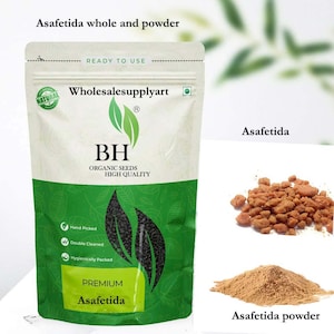 May include: A package of premium asafetida powder and whole asafetida. The package is white and green with the text "Wholesalesupplyart" and "BH Organic Seeds High Quality". The image also shows a pile of whole asafetida and a pile of asafetida powder.