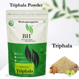May include: A white and green pouch of Triphala powder with the text "Triphala Powder" at the top. The pouch has the text "BH Organic Seeds High Quality" and "Premium Triphala". A pile of brown powder and some dried fruits and green berries are to the right.