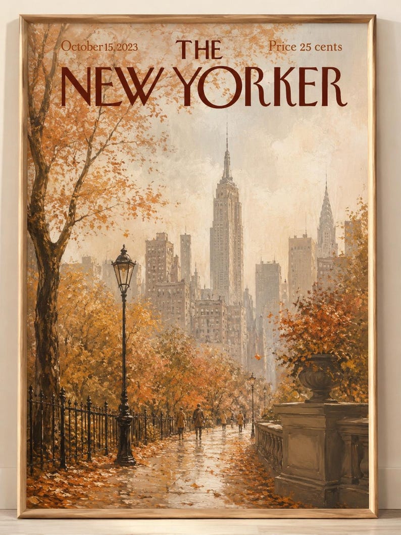 May include: A framed print of The New Yorker magazine cover dated October 15, 2023, featuring an autumnal New York City skyline with orange trees, a street lamp, and pedestrians on a path, all enclosed in a simple light wood frame.