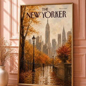 May include: A framed print of The New Yorker magazine cover dated October 15, 2023, featuring an autumnal New York City skyline with golden trees, a wet path covered in fallen leaves, a black lamppost, and the iconic skyscrapers in the distance.