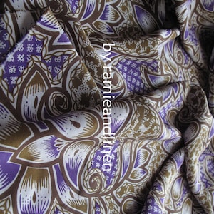 May include: Purple and brown patterned fabric with a paisley design. The fabric is made of ramie and linen.