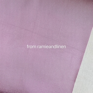 May include: Close-up of a soft, mauve fabric with a subtle sheen. The fabric is smooth and has a slightly textured surface. The text "from ramieandlinen" is visible in the lower center of the image.