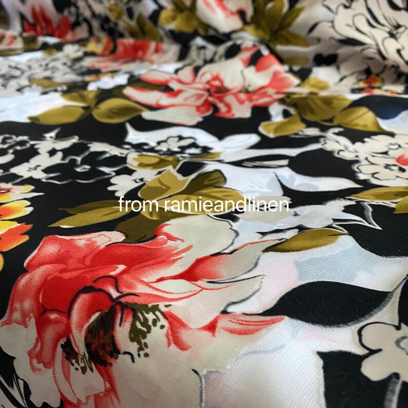 May include: White and black floral fabric with red, yellow, and green flowers. The fabric has a sheer, almost translucent quality. The text "from ramieandlinen" is visible in the lower centre of the image.