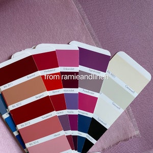 May include: A fan-shaped color chart with 12 different shades of red, purple, and beige. The color chart is labeled with the RAL color codes and German names for each color.