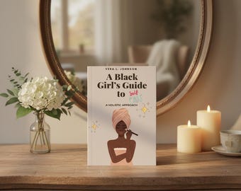 May include: A book titled "A Black Girl's Guide to Self Care" with an illustration of a woman applying makeup. The book is on a wooden surface with a mirror, flowers, and candles in the background.