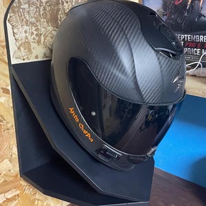 Motorcycle helmet holder
