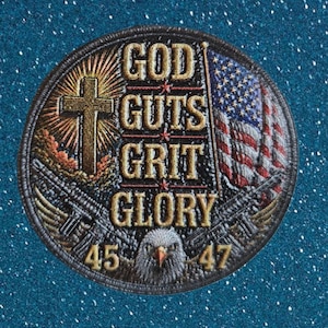 May include: A circular embroidered patch featuring the text GOD GUTS GRIT GLORY in gold lettering. The design includes a cross, an American flag, a bald eagle head at the bottom, and the numbers 45 and 47 on the left and right sides respectively.