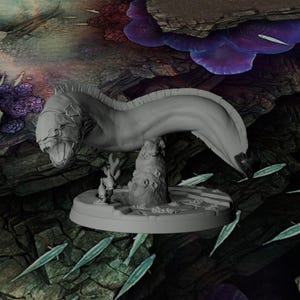 May include: A grey miniature figurine of a long, serpentine creature with an open mouth and visible teeth, mounted on a circular base featuring a central rock formation and small coral-like structures, presented in a neutral, unpainted finish.