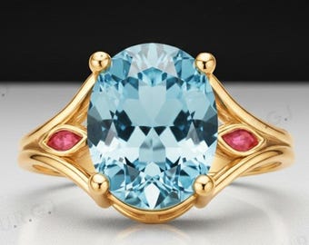 Anel oval em prata 925 com topázio azul celeste.