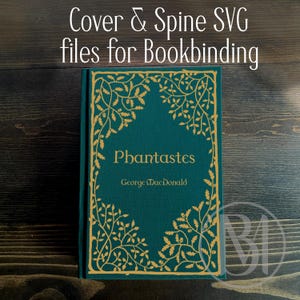 May include: A teal book cover featuring gold-colored decorative vine and leaf patterns along the border. The text on the cover reads Phantastes and George MacDonald. The text above the book reads Cover & Spine SVG files for Bookbinding.