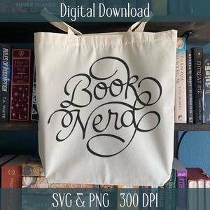 May include: A cream tote bag featuring the words "Book Nerd" in black script. The bag is suspended in front of a bookshelf filled with books. The text "Digital Download" and "SVG & PNG 300 DPI" are also visible on the image.