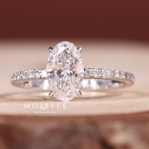 2.00CT Oval Moissanite Engagement Ring: 14K White Gold Half Pave Solitaire