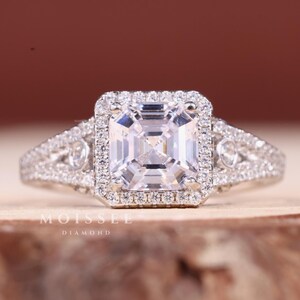 Three Stone 2CT Asscher Cut Moissanite Engagement Ring with elegant side stones, perfect bridal wedding and anniversary gift for her.