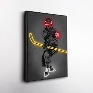 May include: A framed art print featuring a hockey player in a dynamic pose. The player is depicted in black and white with neon yellow and red accents. The neon highlights the hockey stick, helmet, and jersey number 99.