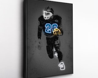 May include: Framed artwork featuring a football player in a black uniform with the number 20 in blue neon. The player is holding a gold football, with white neon outlining the helmet and shoes. The background is a textured gray.